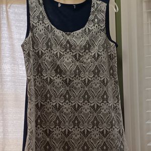 Another unknown maker size is small to medium, Navy Blue with White Lace